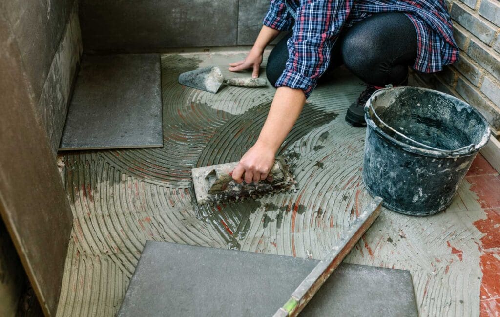 female mason laying tiles on a terrace 2023 11 27 05 34 40 utc